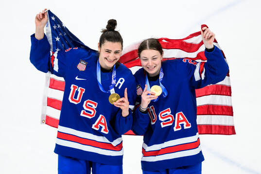 Megan Keller and Tessa Janecke of USA celebrate with their