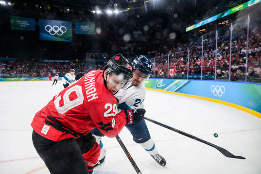 Nathan MacKinnon of Canada and Roope Hintz of Finland in