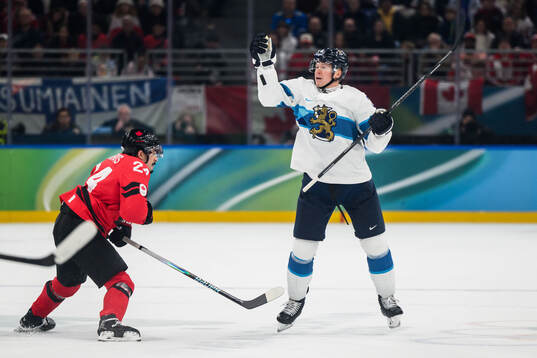 Seth Jarvis of Canada and Olli Määttä of Finland in the