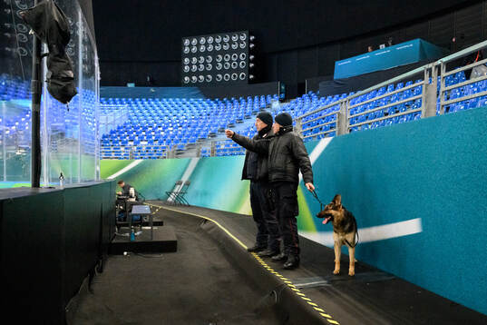 Security personnel with a dog in Milano Santagiulia Ice