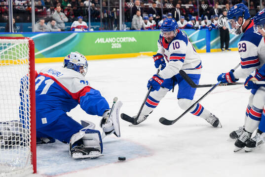 Goaltender Samuel Hlavaj of Slovakia and JT Miller of USA