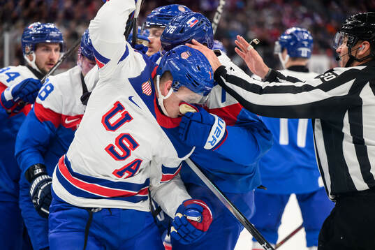 Brady Tkachuk of USA and Martin Pospisil of Slovakia in the