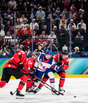 Thomas Harley, Seth Jarvis and Bo Horvat of Canada against