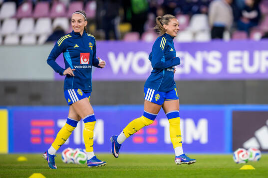 Kosovare Asllani and Johanna Rytting Kaneryd of Sweden