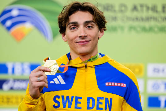 Armand Duplantis of Sweden poses with the gold medal