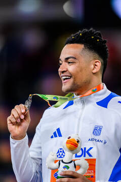 Emmanouil Karalis of Greece celebrates with the silver medal