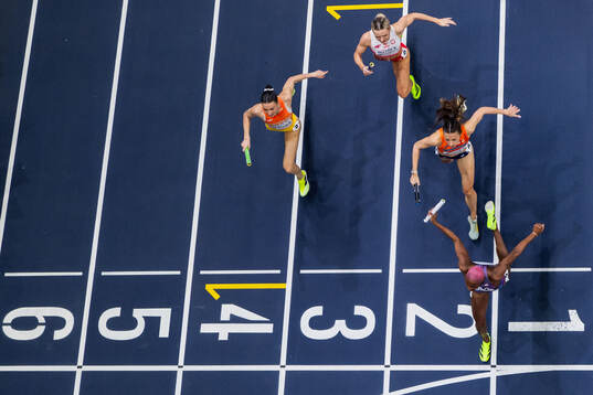 Shamier Little of USA crosses the finish line to win gold