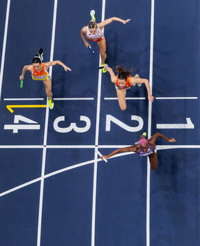 Shamier Little of USA crosses the finish line to win gold