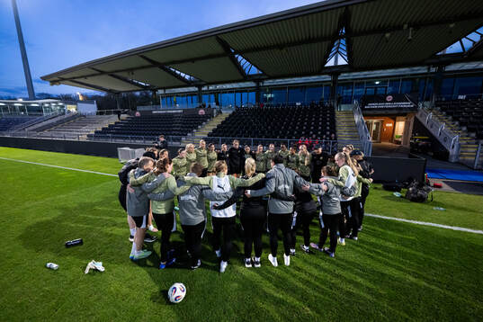 The team gather