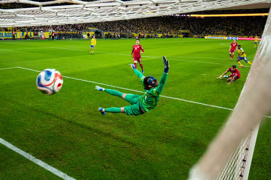 Anthony Elanga of Sweden scores the 1-0 goal behind