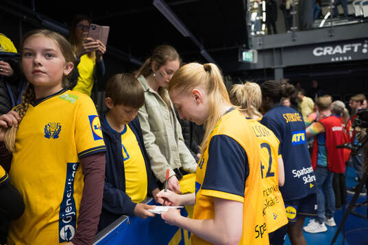 Tyra Axnér of Sweden is writing autographs
