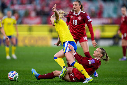 Stina Blackstenius of Sweden and Stine Sandbech of Denmark