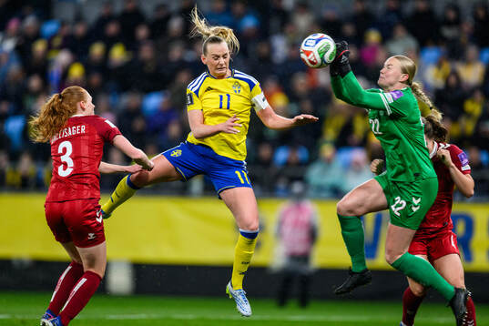 Stina Blackstenius of Sweden and goalkeeper Freja Thisgaard