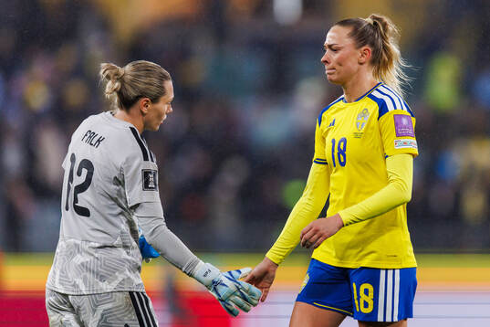 goalkeeper Jennifer Falk and Fridolina Rolfö of Sweden