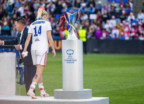 Ada Hegerberg of Lyon looks dejected walking past the trophy