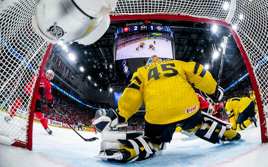 Calvin Thurkauf of Switzerland scores 3-1 past goaltender