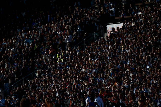 Spectators watch women's 400 meterduring the Diamond League