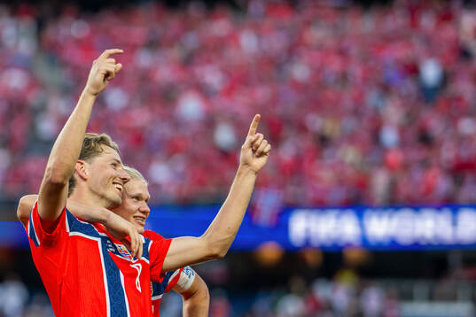 Sander Berge and Erling Braut Haaland of Norway celebrate