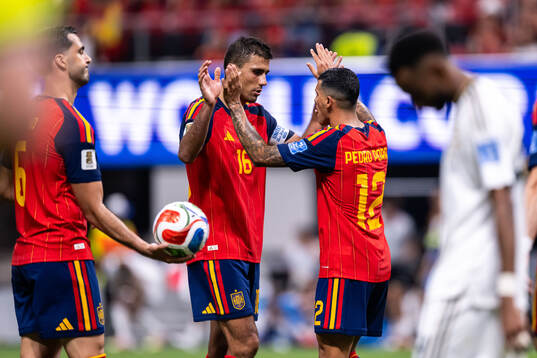 Rodri and Pedro Porro of Spain celebrate