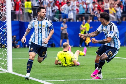 Lionel Messi of Argentina celebrates with Enzo Fernandez