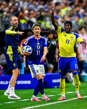 Daizen Maeda of Japan and Anthony Elanga of Sweden