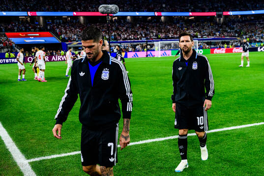 Rodrigo De Paul and Lionel Messi of Argentina