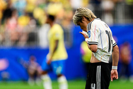 Junya Ito of Japan looks dejected