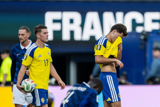 Besfort Zeneli of Sweden looks dejected