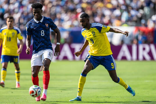 Aurelien Tchouameni of France and Alexander Isak of Sweden