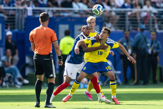 Michael Olise of France and Yasin Ayari of Sweden