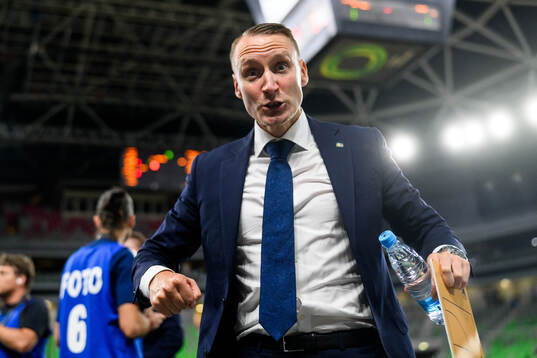 coach Mikko Riipinen of Sweden celebrates