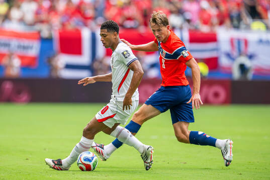 Jude Bellingham of England and Sander Berge of Norway