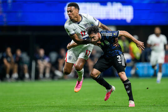 Morgan Rogers of England and Nicolas Tagliafico of Argentina