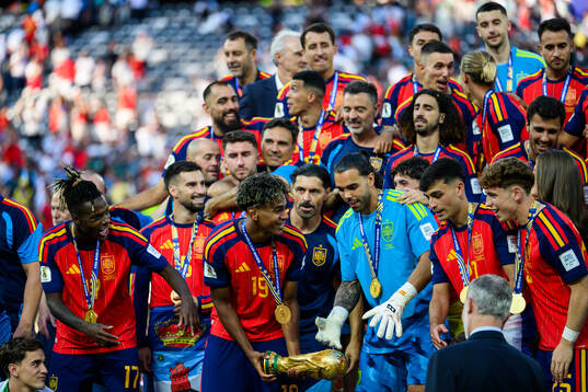 Lamine Yamal of Spain with the trophy