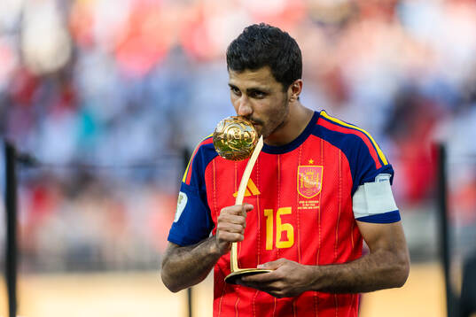 Rodri of Spain with his award for MVP of the tournament