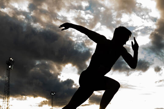 The silhouette of Karsten Warholm competing in men’s 400