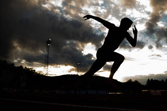 The silhouette of Karsten Warholm competing in men’s 400