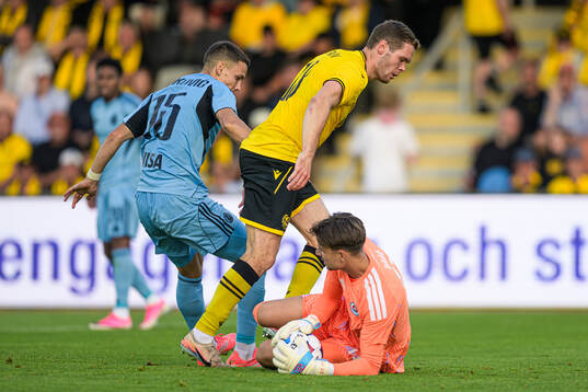Jacob Bergström of Mjällby and goalkeeper Dominik Takác