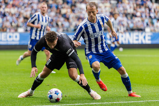 Mathias Delorge of Gent and Sam Larsson of IFK Göteborg