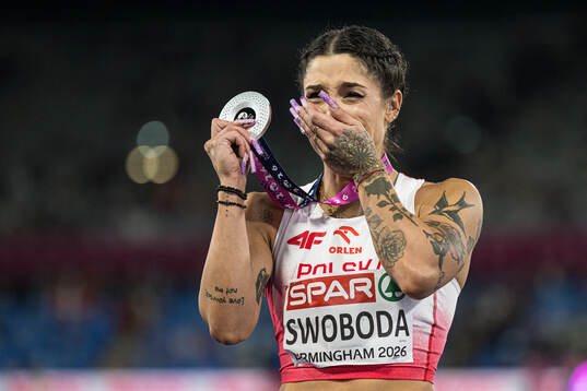 Ewa Swoboda of Poland celebrates