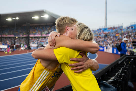 Emil Uhlin of Sweden hugs his mother