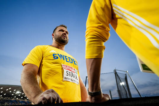Daniel Ståhl of Sweden with his coach