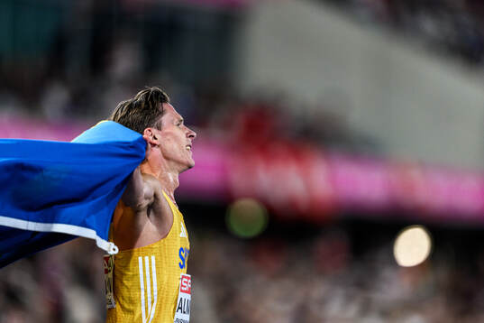 Andreas Almgren of Sweden celebrates first place in men's