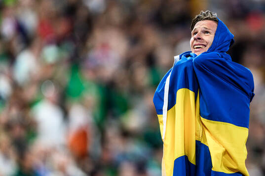 Andreas Almgren of Sweden celebrates first place in men's