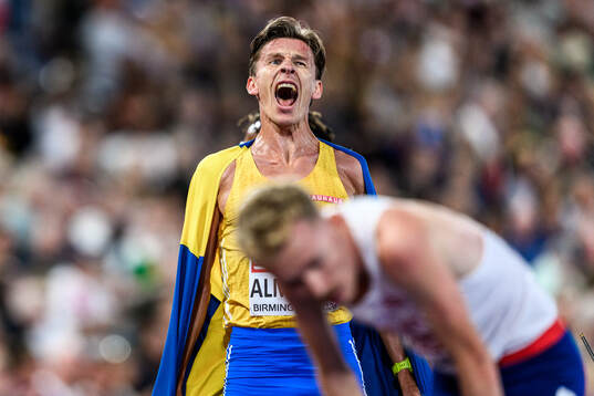 Andreas Almgren of Sweden celebrates first place in men's