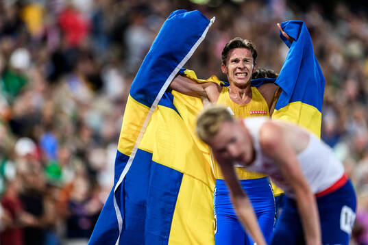 Andreas Almgren of Sweden celebrates first place in men's