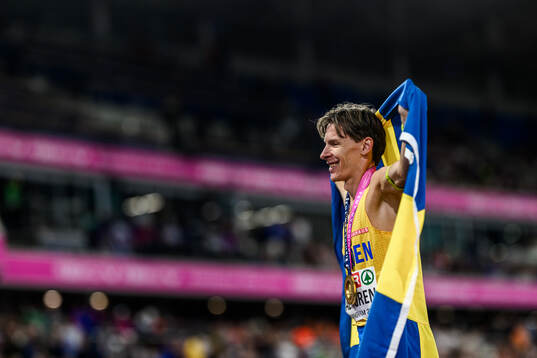Andreas Almgren of Sweden celebrates first place in men's