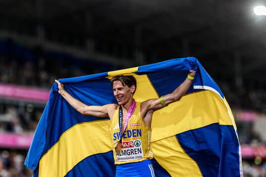 Andreas Almgren of Sweden celebrates first place in men's