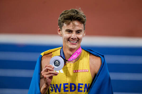 Samuel Pihlström of Sweden celebrates with his silver medal