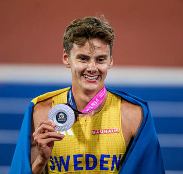Samuel Pihlström of Sweden celebrates with his silver medal
